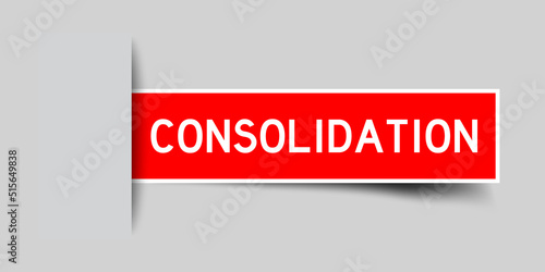 Inserted red color label sticker with word consolidation on gray background
