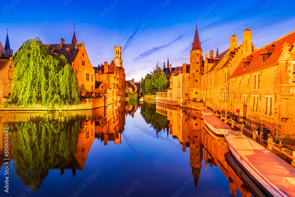 Fototapeta premium Bruges, Belgium. Rozenhoedkaai illuminated at night, old town with Belfry reflection