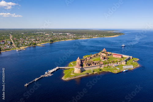 Aerial view of Shlisselburg (Oreshek) Fortress, Ladoga lake and Imeni Morozova settlement on sunny summer day. Ladoga lake, Leningrad Oblast, Russia. photo