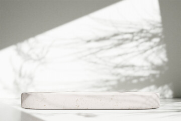 Luxury marble table with plant shadow on white wall and stone podium for product placement display. Trendy neutral aesthetic mockup template for beauty and cosmetics scene.