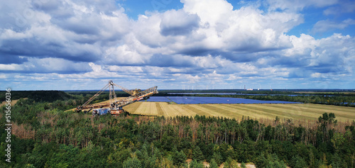 Tableau sur toile Views of a derelict lignite bucket wheel excavator from a distance with a solar