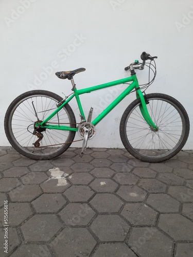 green vintage united bike side view. concept background transport, transportation, bicycle, sport, recreation, riding, lifestyle, commuter bike, old, retro, antique