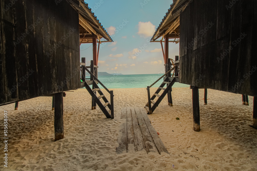 Bungalows on the beach of Koh Rong Samloen in Cambodia, a popular summer travel destination Bungalows on the beach of Koh Rong Samloen in Cambodia, a popular summer travel destination