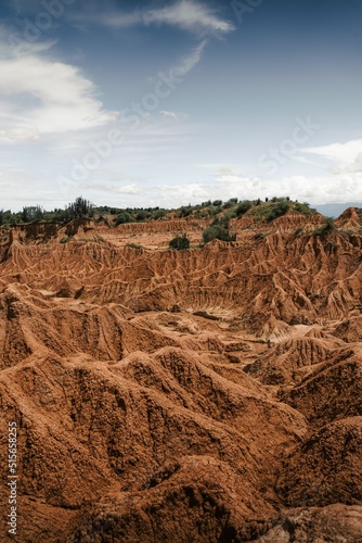 Vertical shot of a scenic view of The Tatacoa Desert or Valley of Sorrows in Huila, Colombia photo