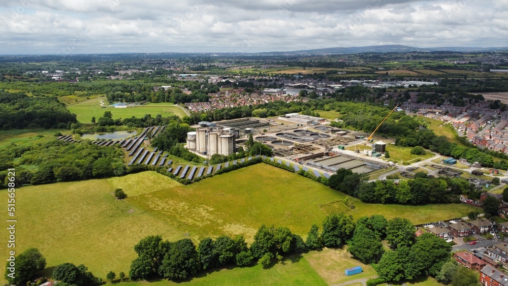 Aerial view looking down onto buildings and green countryside. Taken in Bury England. Aerial view looking down onto buildings and green countryside. Taken in Bury England.