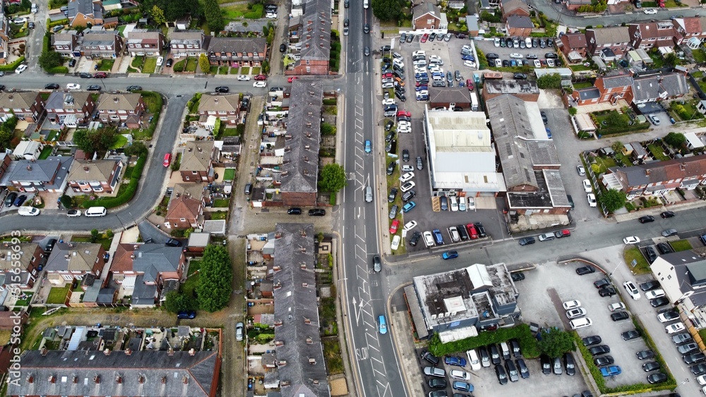 Aerial view looking down onto a busy road with traffic surrounded by buildings. Taken in Bury Lancashire England. 