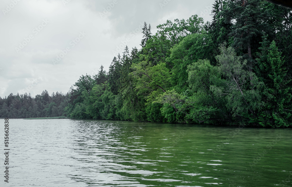 Beautiful mountain lake on a clear day. Lake in mountains. Mountain forest lake. Mountain lake landscape Beautiful mountain lake on a clear day. Lake in mountains. Mountain forest lake. Mountain lake landscape