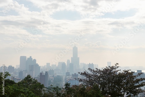 Silhouette of the Kaohsiung Downtown skyline through mist from Shoushan Mountain photo