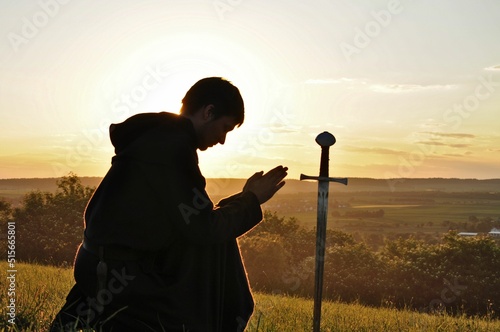 Tela A knight is praying the evening before the battle