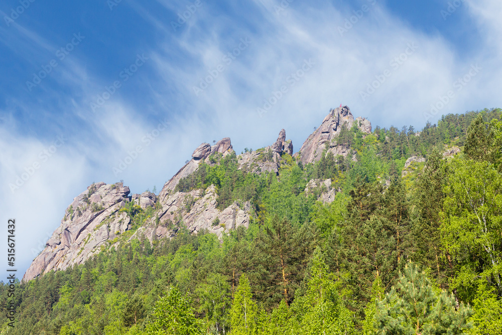 Summer mountain landscape of the Takmak rock pillar in the national natural park of Krasnoyarsk Pillars. Stolby Nature Sanctuary at Krasnoyarsk, Russia