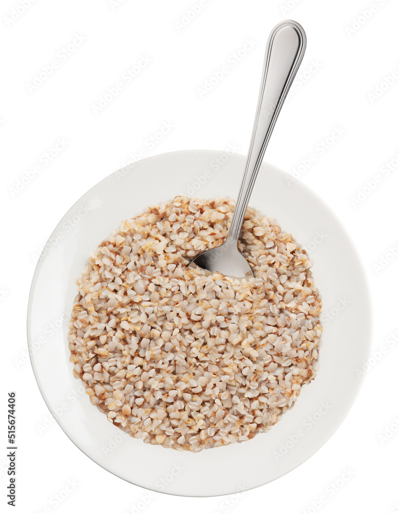 buckwheat porridge on white plate with metal spoon isolated on white. buckwheat porridge on white plate with metal spoon isolated on white.