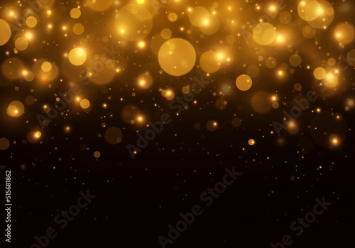 Gold bokeh blurred light. Abstract background with bokeh effect. Magic concept.