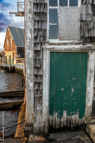 Vertical shot of an old door near the harbor in Osterville, MA, USA photo