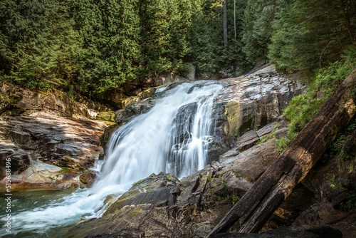 Fototapeta Naklejka Na Ścianę i Meble -  Beautiful view of waterfall on rocks in Hiking Gold Creek Falls, Golden Ears Provincial Park, Canada