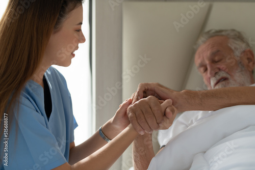 Wallpaper Mural Doctors hold hands and give encouragement to elderly patients who are alone in the hospital's special room. Torontodigital.ca