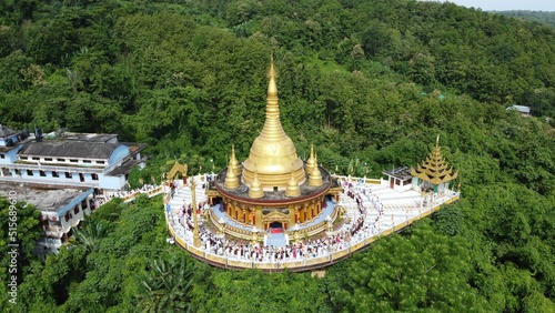 Aerial shot of the Buddha Dhatu Jadi in Bandarban, Bangladesh surrounded by greenery photo