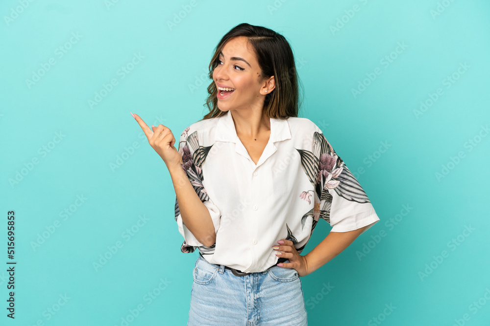 Young woman over isolated blue background intending to realizes the solution while lifting a finger up Young woman over isolated blue background intending to realizes the solution while lifting a finger up