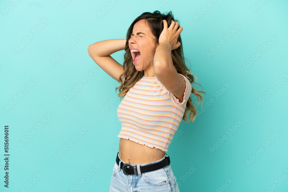 Young woman over isolated blue background stressed overwhelmed Young woman over isolated blue background stressed overwhelmed