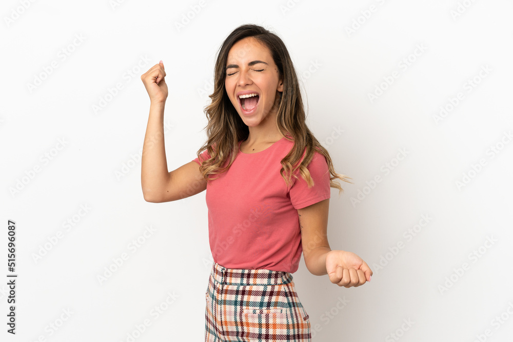 Young woman over isolated background celebrating a victory Young woman over isolated background celebrating a victory