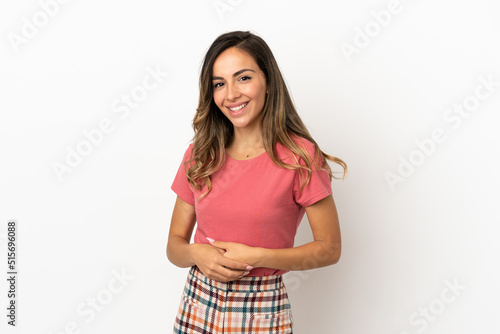 Young woman over isolated background laughing