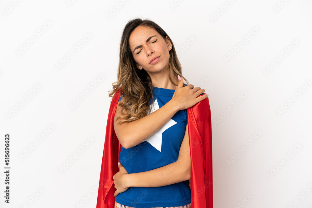 Super Hero woman over isolated white background suffering from pain in shoulder for having made an effort Super Hero woman over isolated white background suffering from pain in shoulder for having made an effort