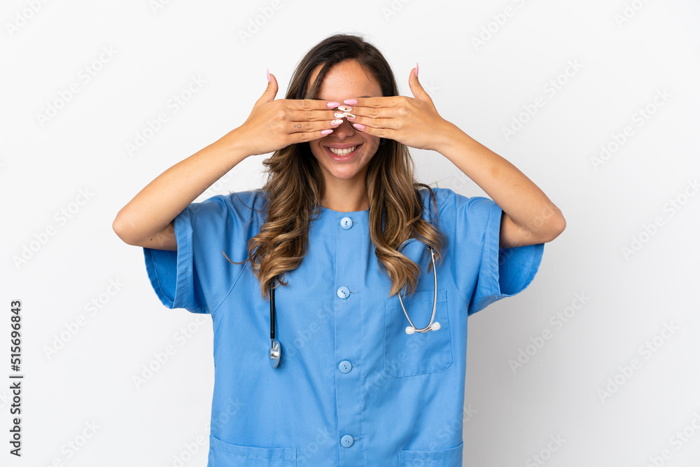 Young surgeon doctor woman over isolated white wall covering eyes by hands Young surgeon doctor woman over isolated white wall covering eyes by hands