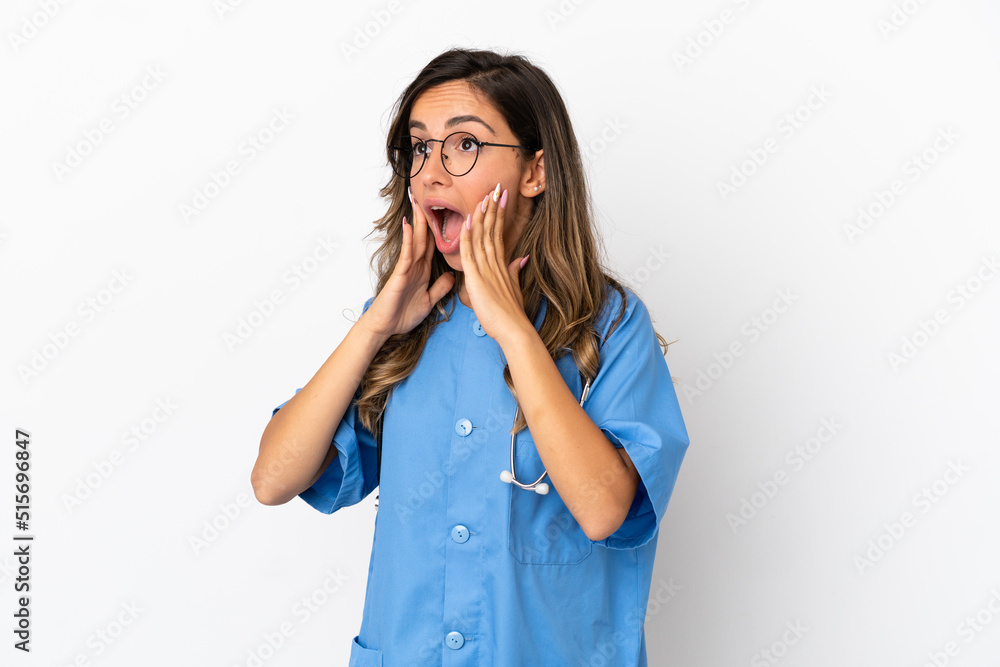 Young surgeon doctor woman over isolated white wall with surprise facial expression Young surgeon doctor woman over isolated white wall with surprise facial expression