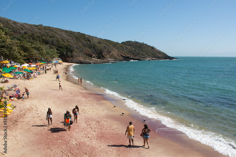Beautiful beach of Jao Fernandez, in Buzios, Brazil, on a sunny day, surrounded by hills and blue water. Beautiful beach of Jao Fernandez, in Buzios, Brazil, on a sunny day, surrounded by hills and blue water.
