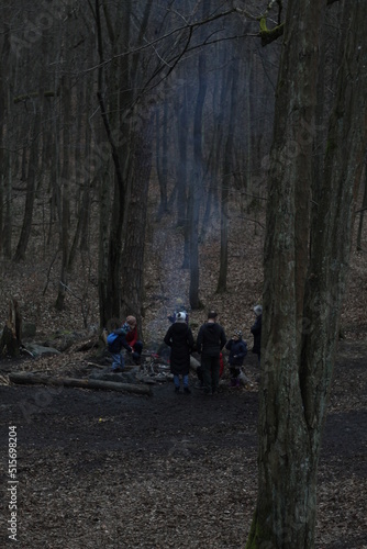 people camping in the woods during cold days