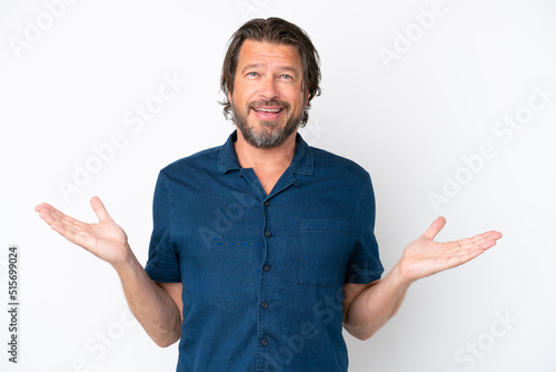 Senior dutch man isolated on white background with shocked facial expression