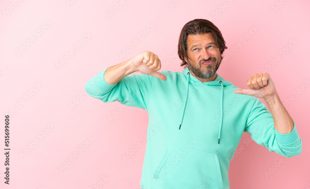 Senior dutch man isolated on pink background proud and self-satisfied Senior dutch man isolated on pink background proud and self-satisfied