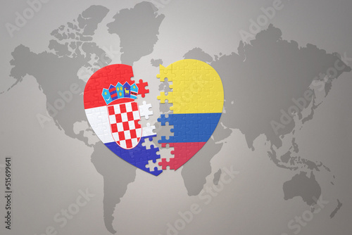 puzzle heart with the national flag of croatia and colombia on a world map background.Concept.