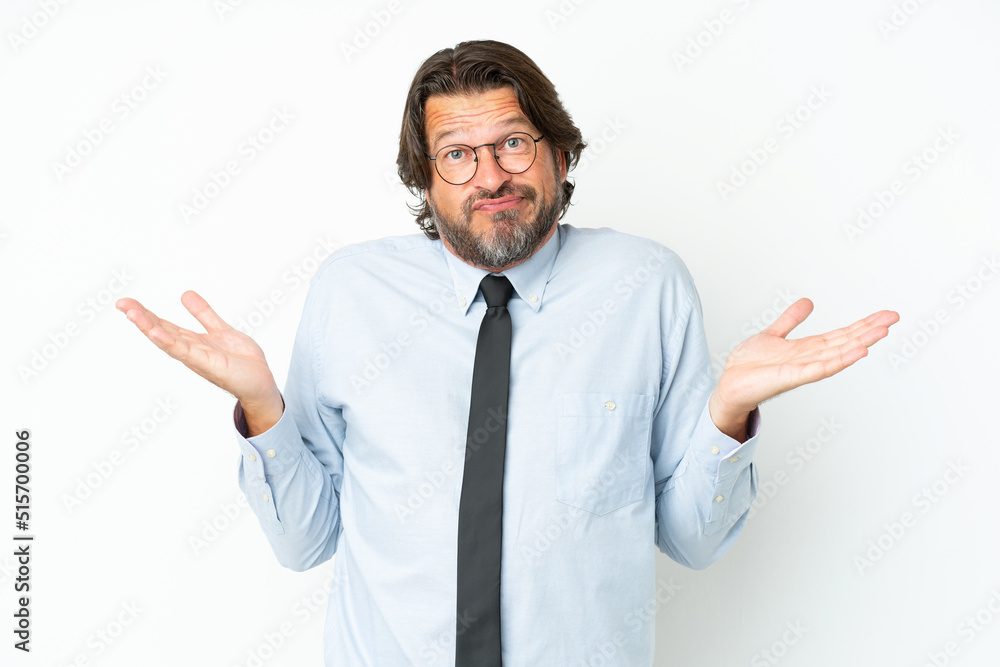 Senior dutch business man isolated on white background having doubts while raising hands Senior dutch business man isolated on white background having doubts while raising hands