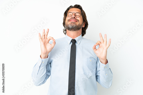 Senior dutch business man isolated on white background in zen pose