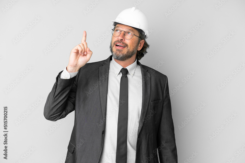 Young architect man with helmet over isolated background intending to realizes the solution while lifting a finger up