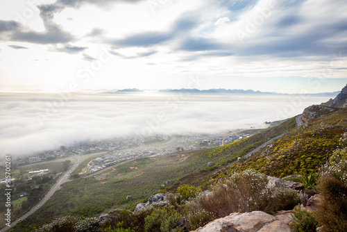 The southern suburbs of Cape Town from silvermine  covered in fog down below.