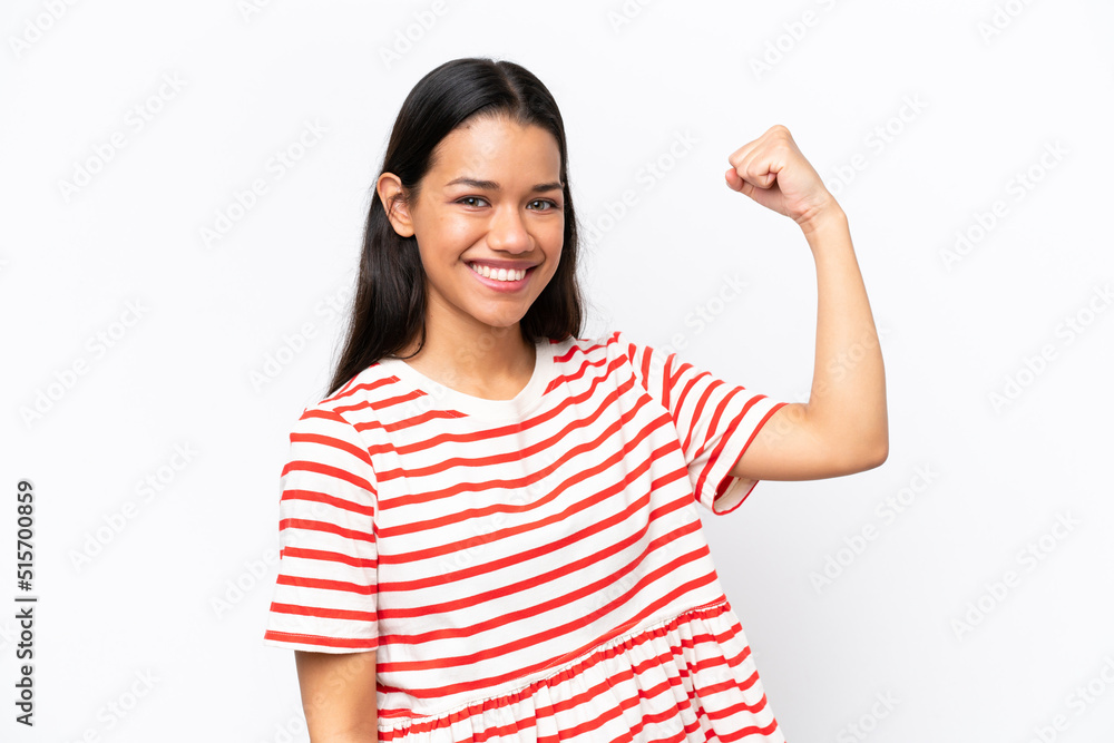 Young Colombian woman isolated on white background doing strong gesture Young Colombian woman isolated on white background doing strong gesture