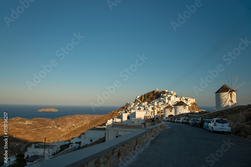 View over famous windmills and Chora town with traditional style white houses on Serifos island in Greece