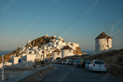View over famous windmills and Chora town with traditional style white houses on Serifos island in Greece