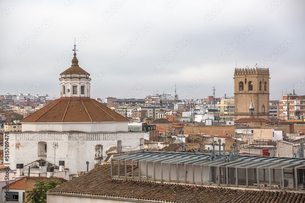 View from the top of buildings in downtown Badajoz, cityscape, contrast between classic tower ornamented cupolas buildings and more modern buildings, Spain