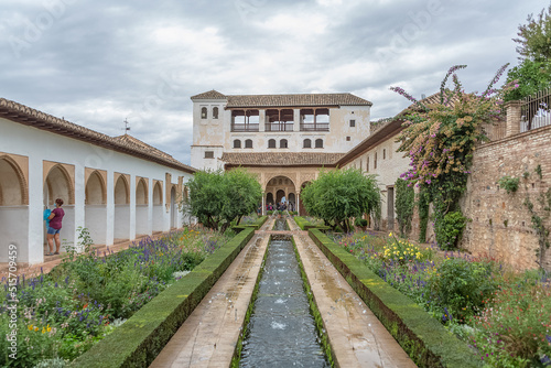 Exterior view at the Garden Water Channel, or Patio de la Acequia, on Generalife Gardens, inside at the Alhambra citadel, alcazaba, Granada, Andalusia, Spain photo