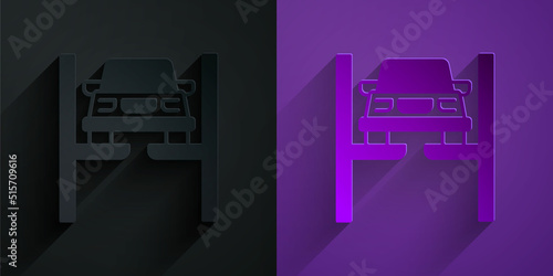 Paper cut Repair car on lift icon isolated on black on purple background. Repair of the underbody, suspension, wheels and engine. Paper art style. Vector
