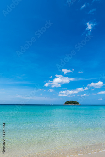 Beach in Thailand, South East Asia, with white and golden sand, blue sky, in tropical vacation area. Kata beach in Phuket, Thailand, a photo with copyspace.