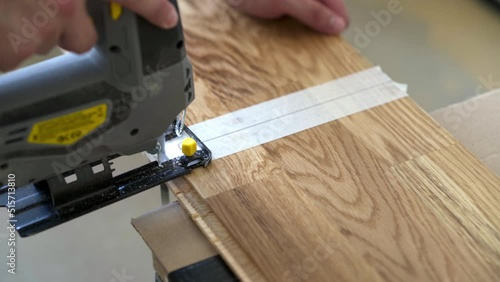 	Cutting Parquet Floor Board With Jigsaw