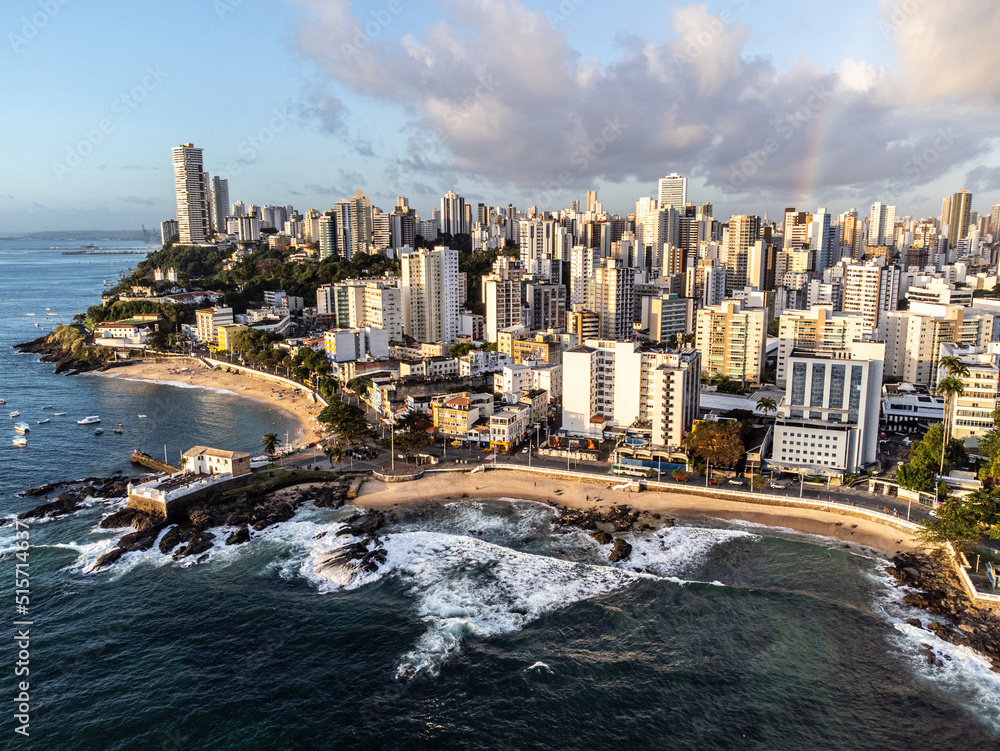 Fototapeta premium Tip of Salvador with beautiful sunset lighting in a large coastal city with beach, Bahia, Brazil