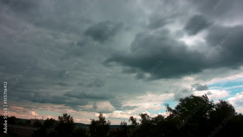 Sunset sky with black storm clouds during sunset, time lapse Sunset sky with black storm clouds during sunset, time lapse