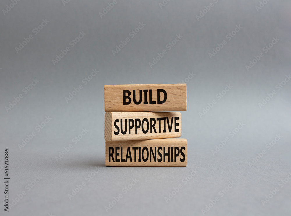 Build Supportive Ralationships symbol. Wooden blocks with words Build Supportive Ralationships. Beautiful grey background. Business and Build Supportive Ralationships. Copy space. Build Supportive Ralationships symbol. Wooden blocks with words Build Supportive Ralationships. Beautiful grey background. Business and Build Supportive Ralationships. Copy space.
