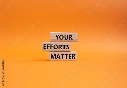 Your Effort Matter symbol. Wooden blocks with words Your Effort Matter. Beautiful orange background. Business and Your Effort Matter concept. Copy space.