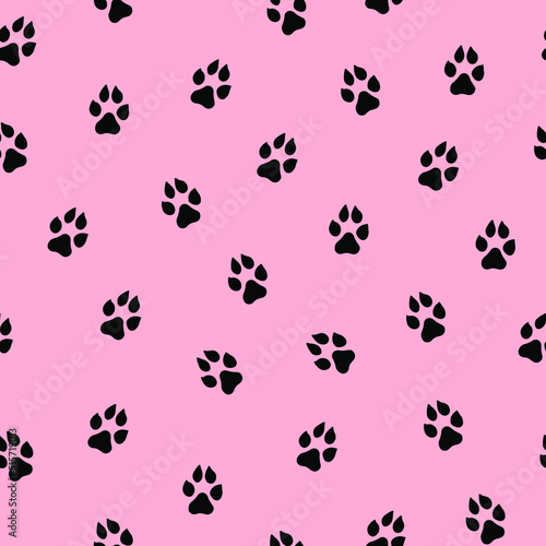 Seamless vector pattern with cute cat or dog paws. Animal footprint on pink background.