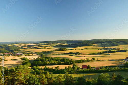 landscape in the thuringian Eichsfeld with view to the village Rustungen